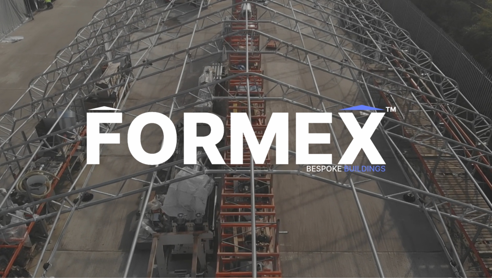 custom industrial fabric structure with FORMEX logo overlay